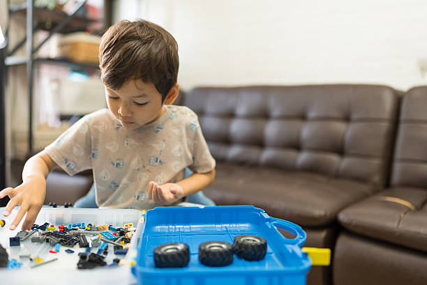 Little boy playing with building blocks