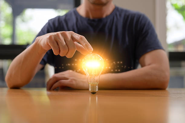 A man with glowing light bulb in concept of creative and ideas, digital prompt interface, symbolizing artificial intelligence innovation, prompt engineering creative technology solutions.