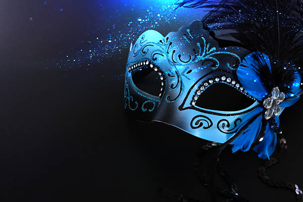 Venetian mask with decorations over black background