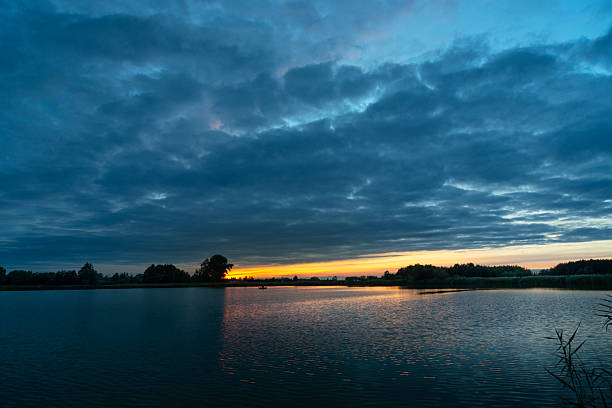 Evening clouds after sunset over the lake, Stankow, Lubelskie, Poland