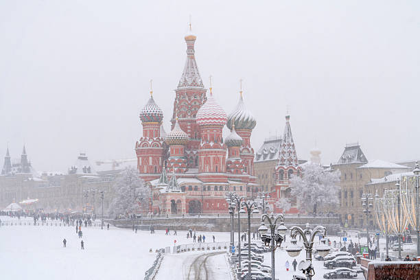 St. Basil's Cathedral on Red Square from Bolshoy Moskvoretsky Bridge during heavy snowfall, Moscow, Russia