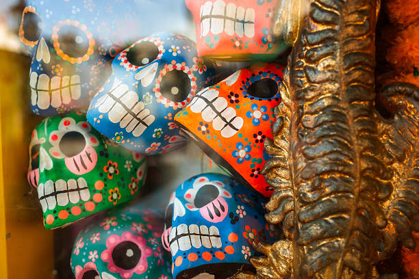 Hand-painted skulls in the window for the Mexican day of the dead.