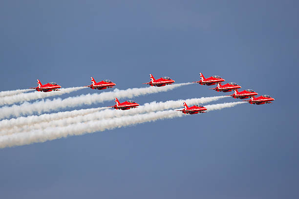 Ostrava, Czech Republic - September 18, 2025: Royal Air Force Red Arrows aerobatic team flying display. BAE Hawk military trainer aircraft.