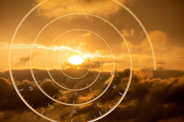 Abstract spiral clock overlay on dramatic golden sunset clouds symbolizing the passage of time, future planning, new beginnings, infinity and life journey. Concept image suitable for business strategy, investment, motivation, personal development, marketing campaigns and inspirational content.