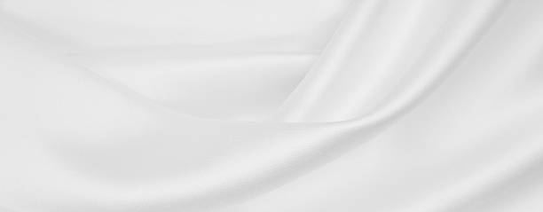istock Smooth elegant white silk or satin luxury cloth texture as wedding background. Luxurious background design 2259612582