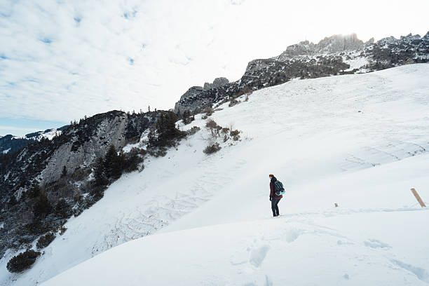 Winter hiking on a mountain blizzard