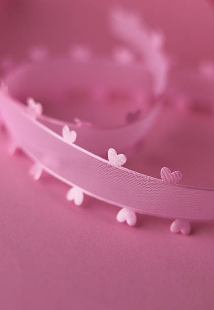 Pink hearts decoration on pink paper background