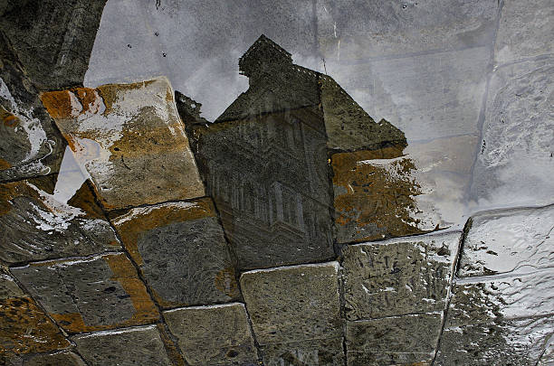 Cobblestone street in Florence reflecting the image of the Cathedral