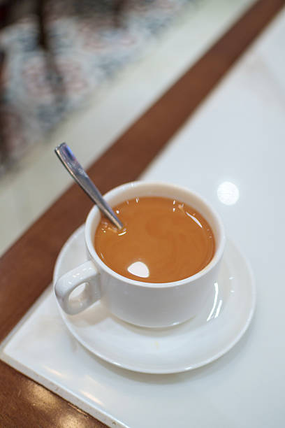 Hot Masala Milk Tea Served in White Cup on Table