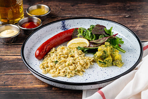 German sausage served with creamy pasta and mustard sauces