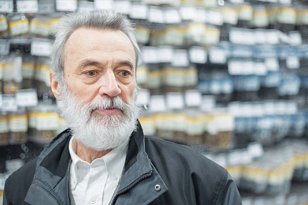 Mature adult male choosing items at a hardware store