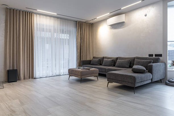 istock Spacious modern living room with sectional sofa and terrace access 2259685076