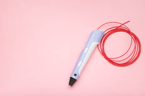 Purple 3D pen for kids creativity on pink background. Top view