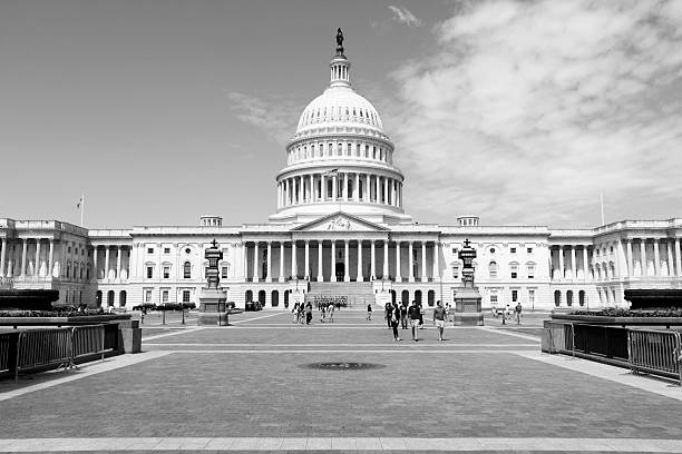 People walk by US National Capitol in Washington DC. 18.9 million tourists visited capital of the United States in 2012.