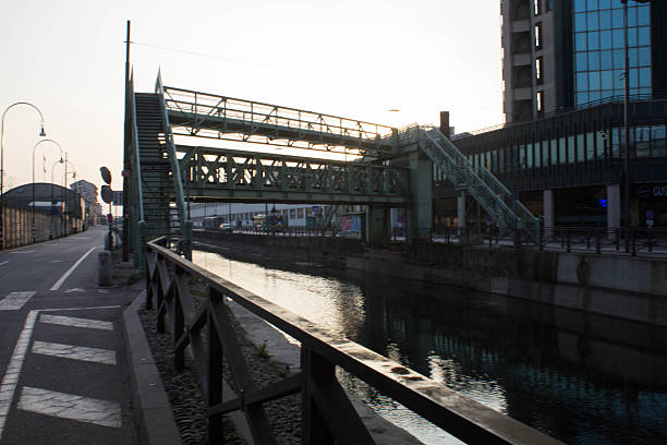 evocative image of the iron bridge along the Naviglio usedto connect a ceramic factory with the railway
