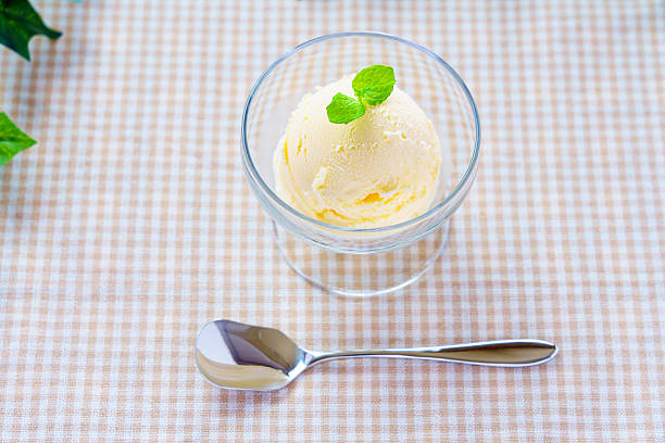 Vanilla ice cream in glass cup with mint
