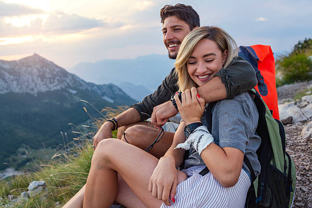 istock Couple resting after hiking 2259710470