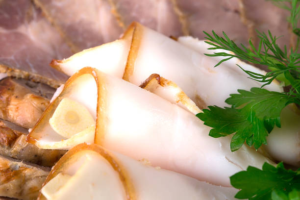 Delicious curled salted lard fat as a traditional snack. Macro. Photo can be used as a whole background.