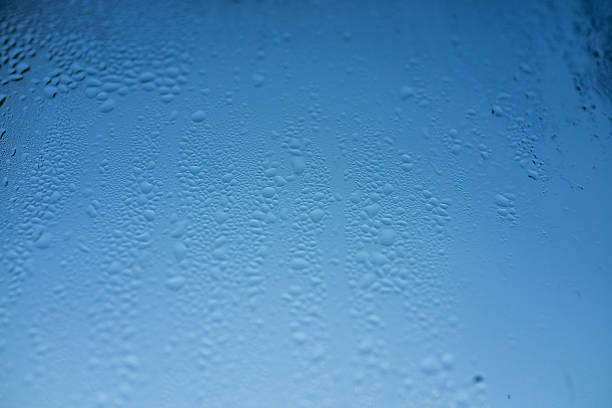 minimal blue glass showing subtle condensation and fine texture, clean cool gradient and open space designer