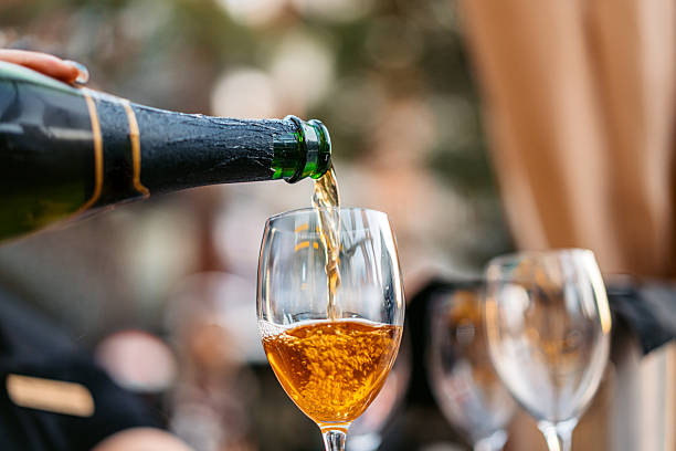 istock Pouring Aged White Wine In A Restaurant Outdoors 2259724582