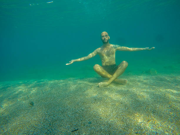 Underwater portrait of a middle aged man swimming during summer vacation