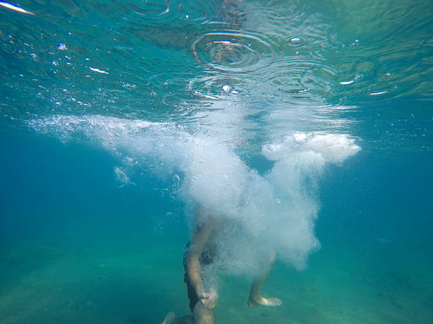 Underwater portrait of a middle aged man swimming during summer vacation