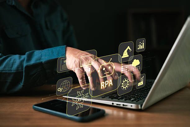 istock Businessman using laptop with RPA Robotic Process Automation concept on virtual screen. AI technology manages data for automated workflow, industrial manufacturing, and digital business efficiency. 2259736362