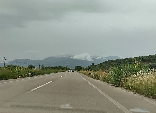 Mountains on the horizon above the road