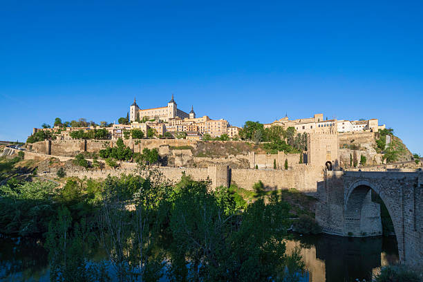 Panoramic view of Toledo, an ancient city nestled in a bend of the river Tagus in central Iberia: on the hill, stands out the Alcázar, a large quadrangular fortification, mostly rebuilt between 1939 and 1957