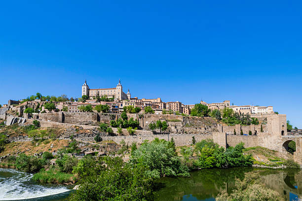 Panoramic view of Toledo, an ancient city nestled in a bend of the river Tagus in central Iberia: on the hill, stands out the Alcázar, a large quadrangular fortification, mostly rebuilt between 1939 and 1957