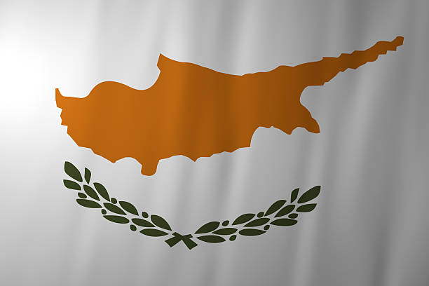 The national flag of Cyprus featuring a copper-colored map of the island above green olive branches on a white field. The symbols represent peace, unity, and the country’s geographic identity.