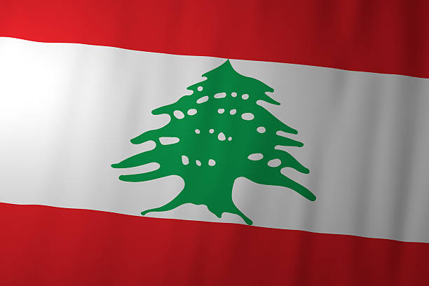 The national flag of Lebanon featuring red and white horizontal colors with a green cedar tree at the center. The image represents Lebanese sovereignty, national identity, and cultural heritage.
