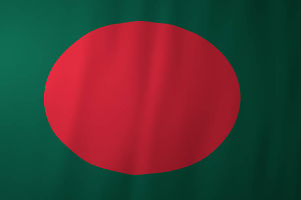 The national flag of Bangladesh featuring a red circle centered on a green field. The design symbolizes independence, sacrifice, and the country’s natural landscape as part of national identity.