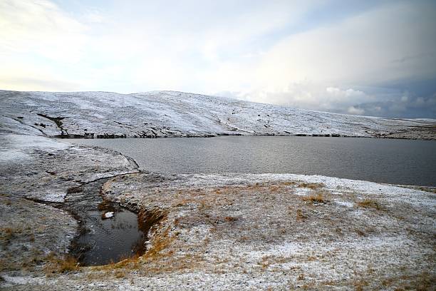 An autumn landscape, with a lake, on Mageroya Island unfolds on the way to Nordkapp along the northern coast of Norway.