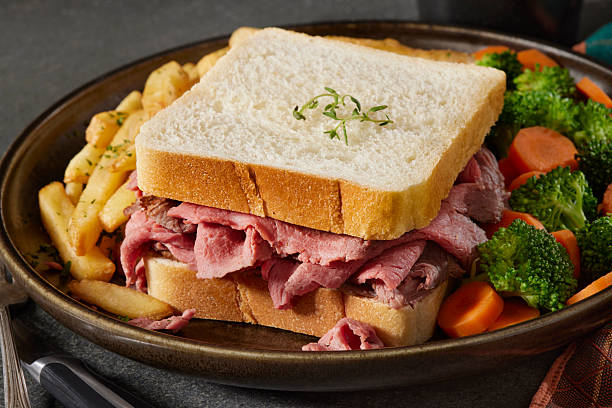 Medium Rare Roast Beef Sandwich with Vegetables and Fries