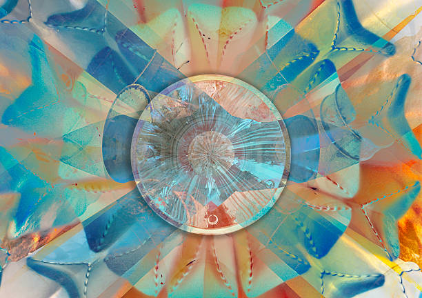 Digitally created abstract composition featuring a circular glass-like center surrounded by layered radial shapes in soft blue, teal, and warm orange tones. The image suggests light refraction, symmetry, and motion, making it suitable for themes related to modern design, energy, technology, optical effects, and decorative abstract backgrounds.