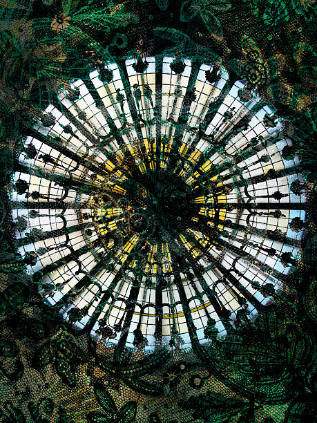 Digitally composed abstract image featuring a circular, radial glass ceiling or dome structure with repeating window segments and decorative details. The design is layered with a dark green floral and lace-like texture overlay, creating a complex ornamental background.