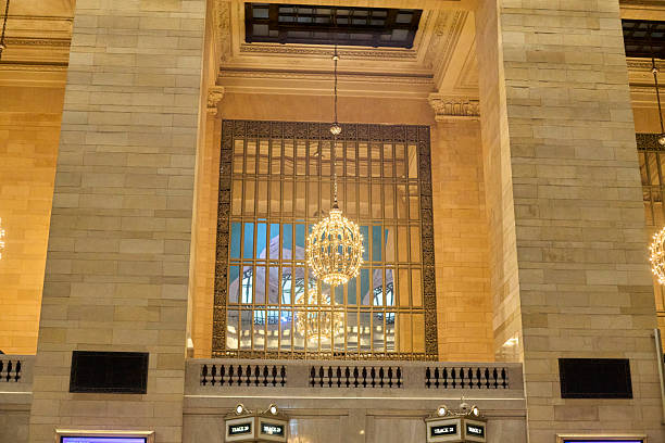 Interior of the historic Sirkeci train station in Istanbul, Turkey. The waiting hall features arched stained glass windows and traditional architectural details. Sirkeci station is known as the former terminus of the famous Orient Express and remains an iconic transportation hub in the city.