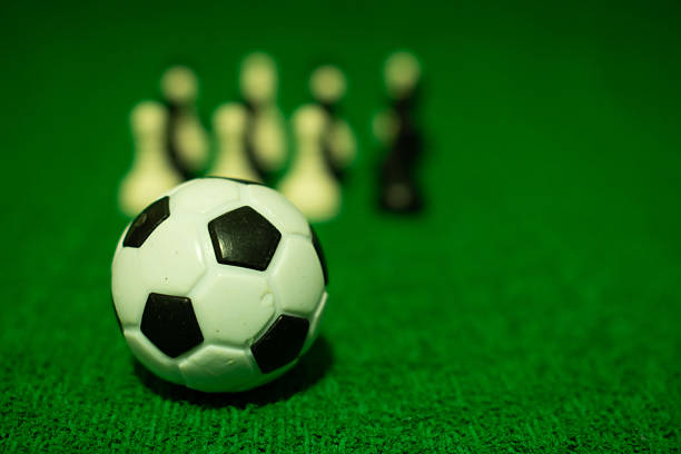 Soccer players jumping to hit the ball with their heads during a corner kick