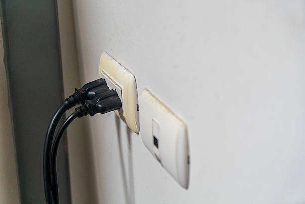 istock Close-Up of Electrical Wall Socket with Plugs 2259802449