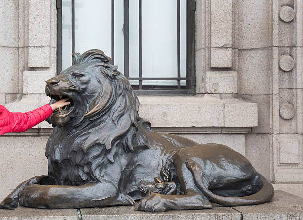 China, Shanghai,  bronze lion on The Bund  outside the HSBC  bank. public square