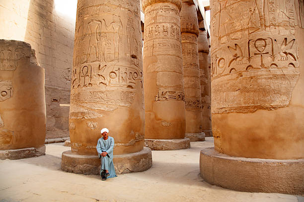 Egypt, Luxor , tourist guide at Karnak palace  ancient ruins