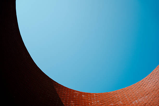 Old building with exposed red brick and beautiful blue sky
