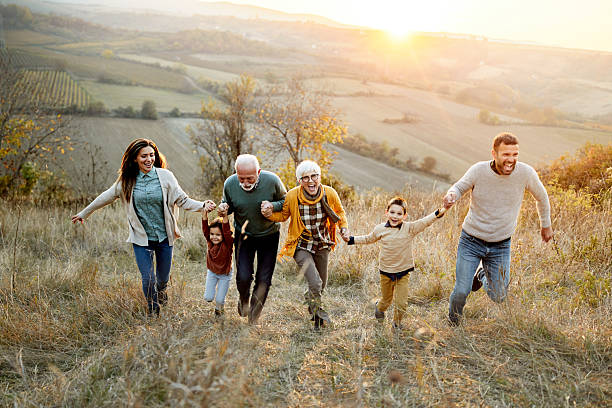 istock Playful extended family having fun in autumn day at sunset. 2259820207