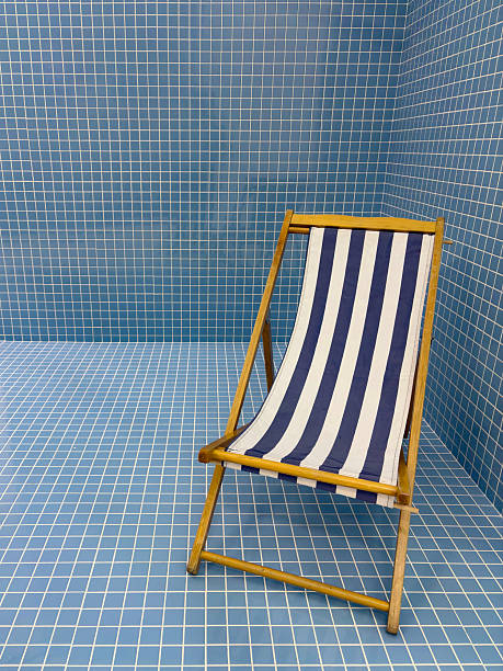 Image of beach chair over blue background