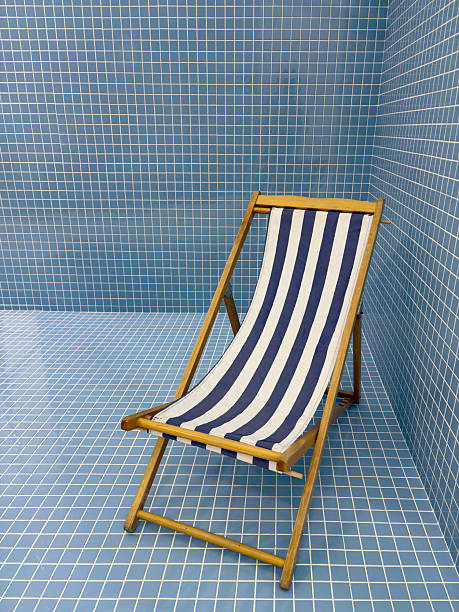 Image of beach chair over blue background