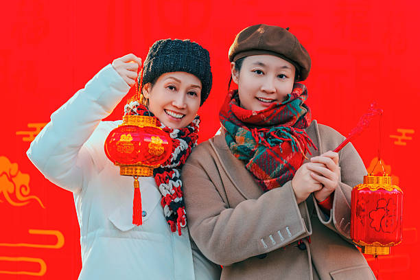 Two Women Celebrating Chinese New Year with Red Lanterns