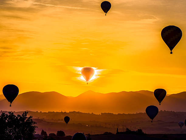 Hot Air Balloon ready to rise into the blue sky showing a kaleidoscope of colors at a Ballooning Fiesta