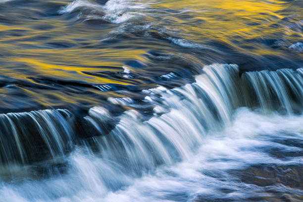Waterfalls in Autumn at Presque Isle River Falls Loop Trail in Porcupine Mountains, Michigan, USA