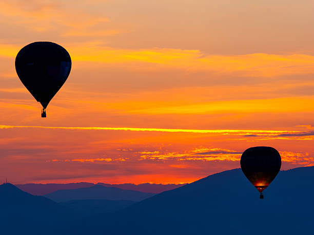 Umbria, Italy:Hot air balloons in flight at dawn